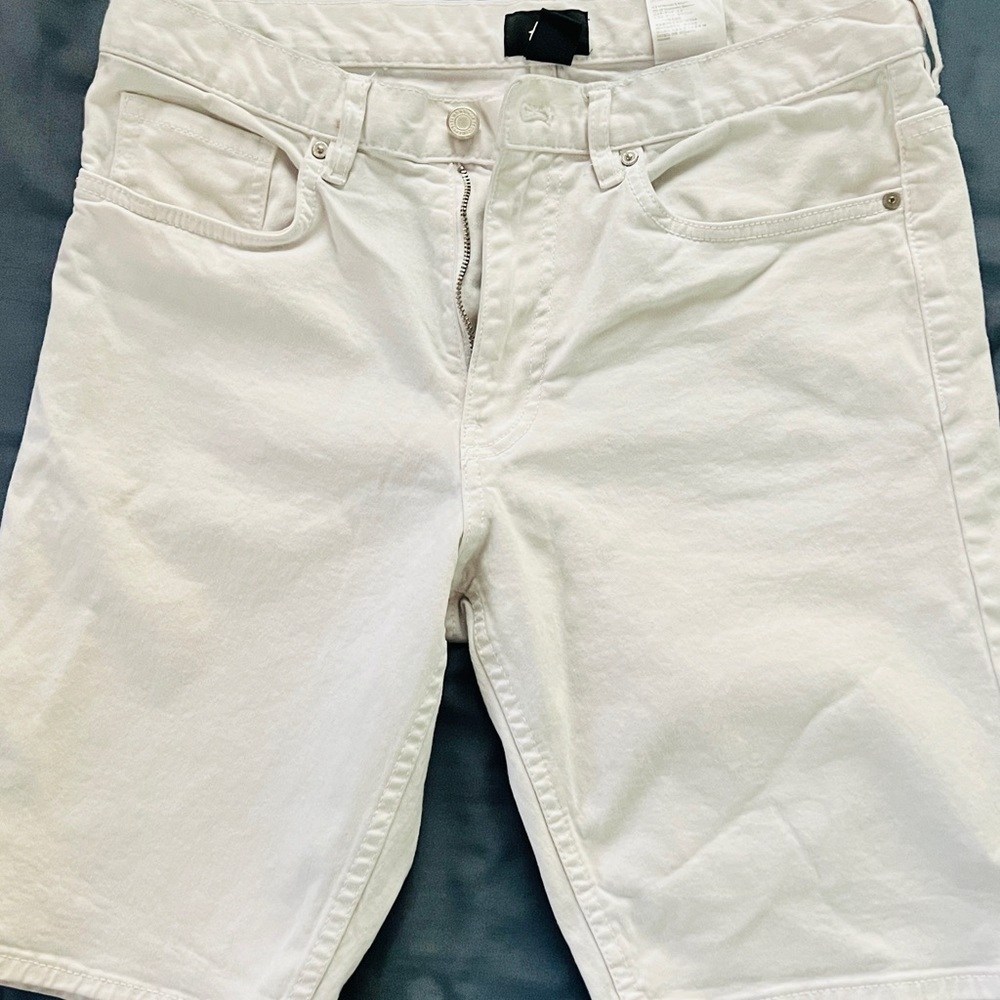 White denim shorts. Slim fit